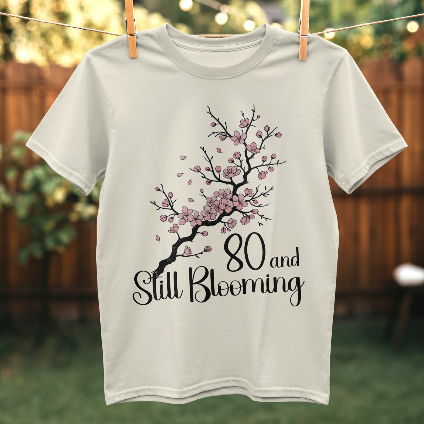 80 and Still Blooming graphic tee product type