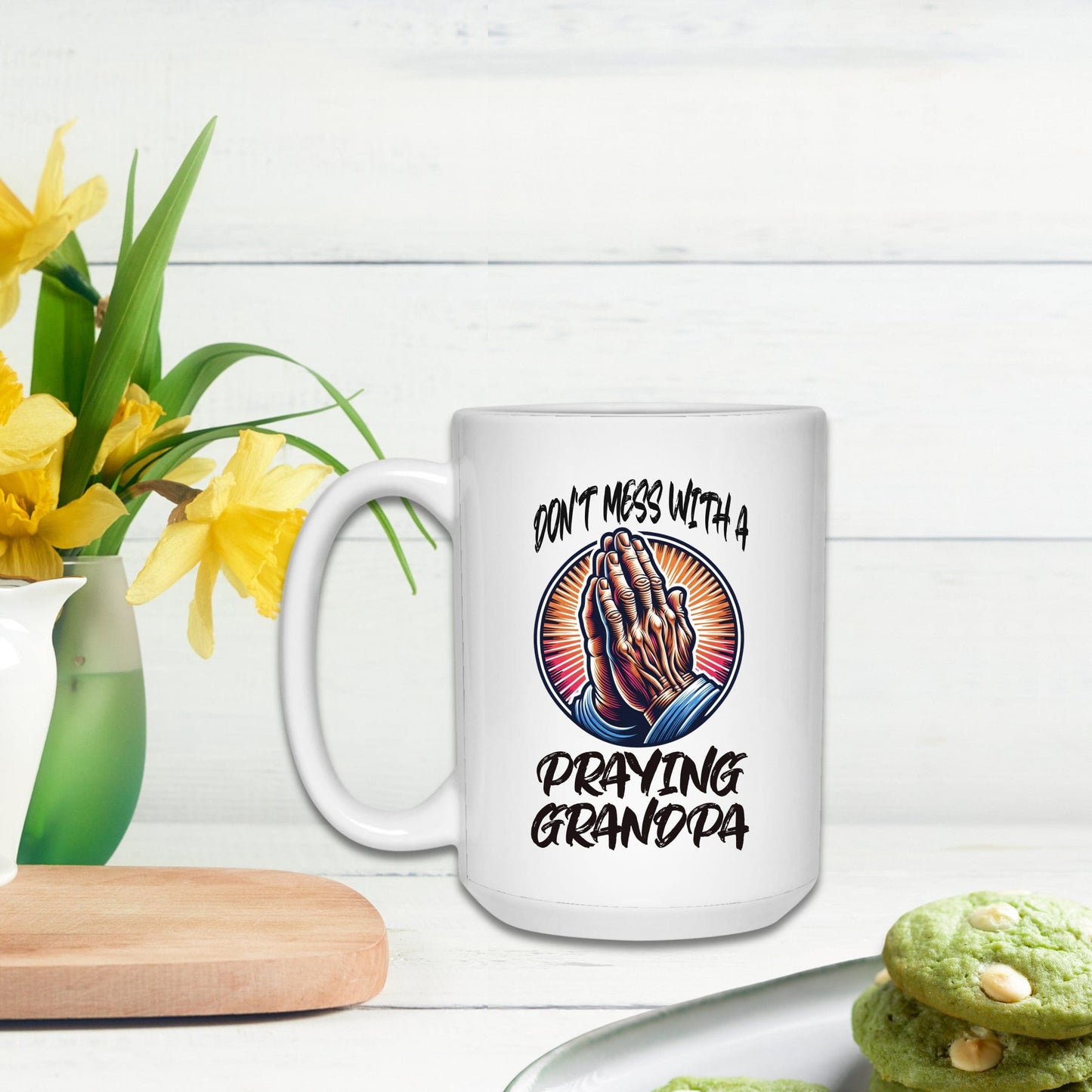 a white coffee mug with praying grandpa on it