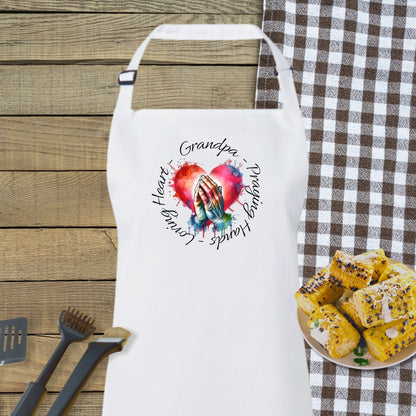 a white apron sitting next to a plate of food