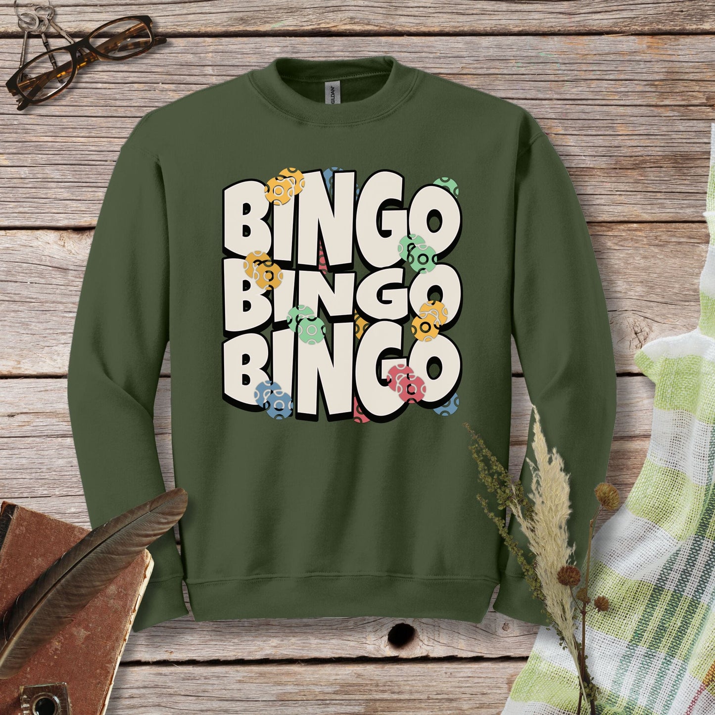 a green sweatshirt with the words bingo bingo on it