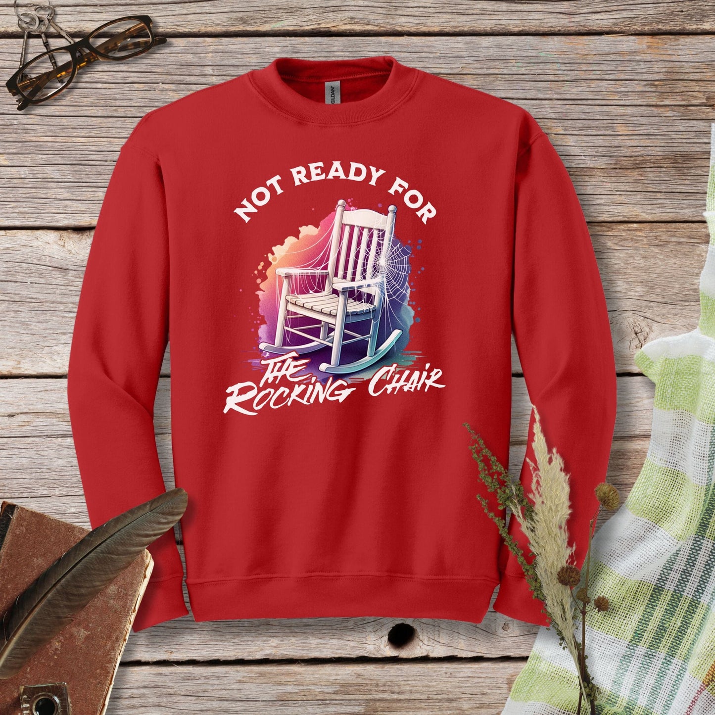 a red sweatshirt with a picture of a rocking chair on it