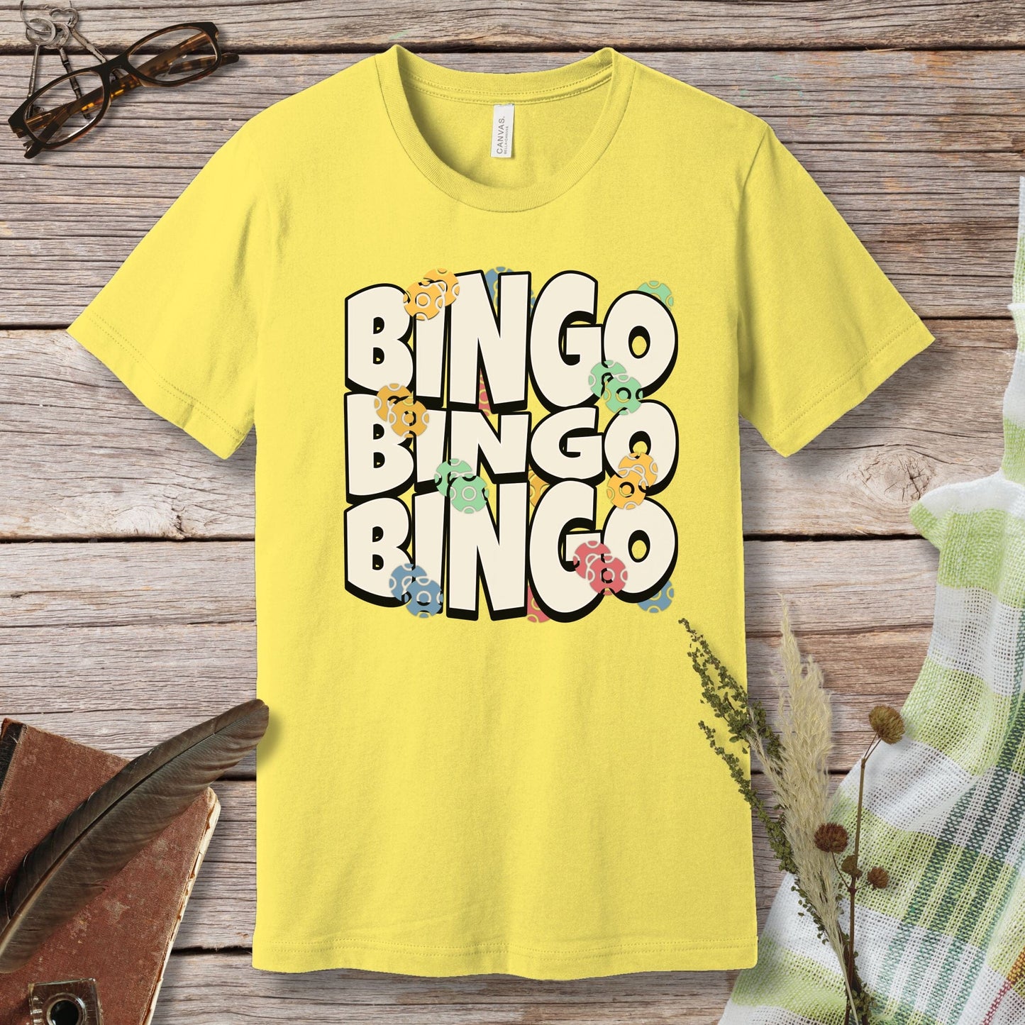 a yellow t - shirt with the words bingo bingo on it