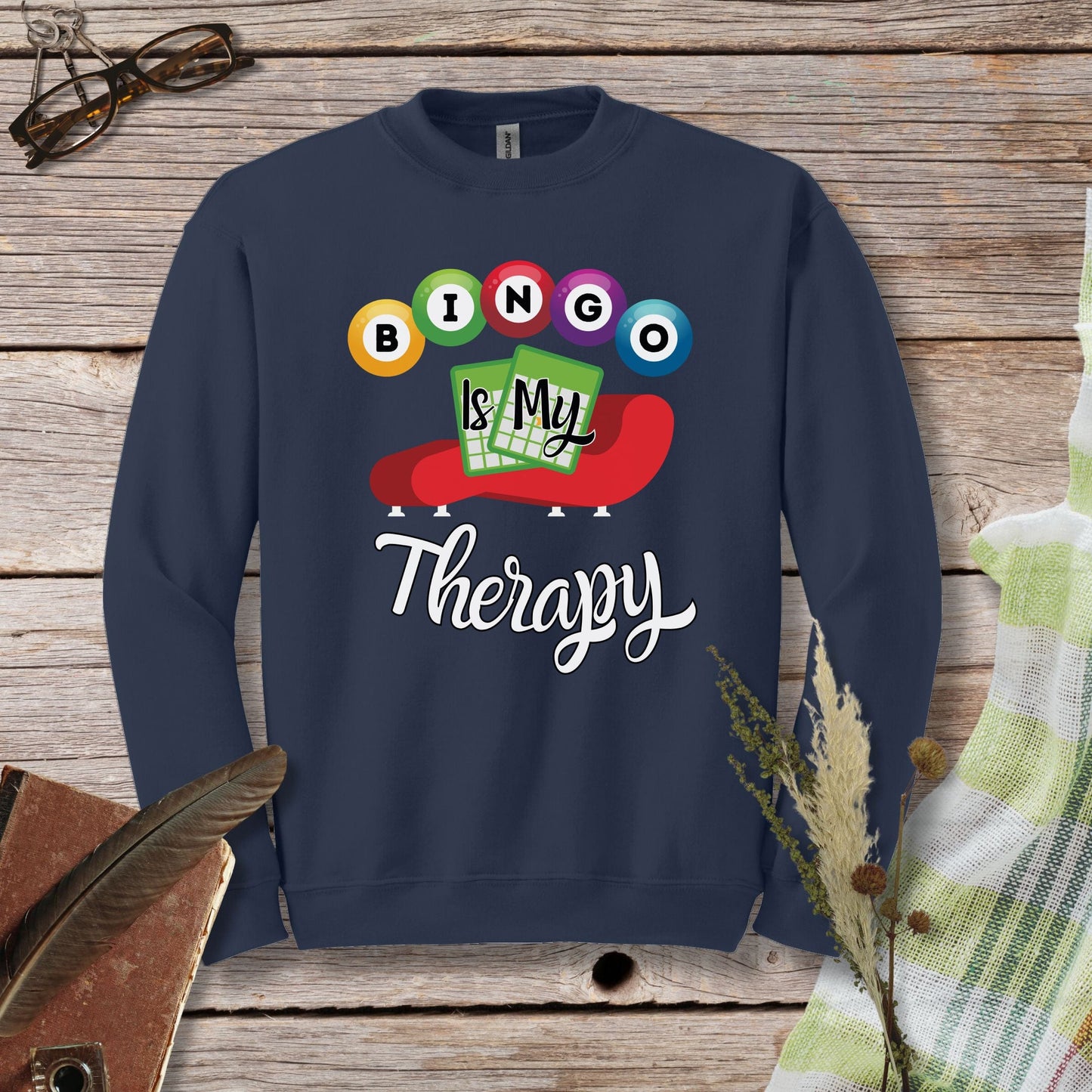 a sweatshirt that says bingo is my therapy