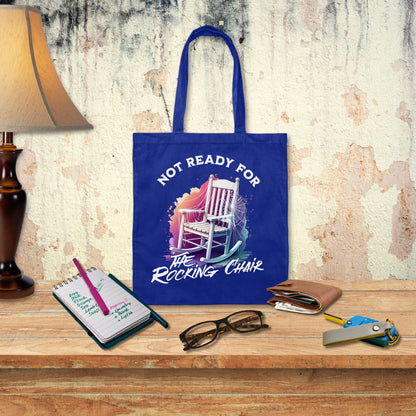 a blue tote bag sitting on top of a wooden table