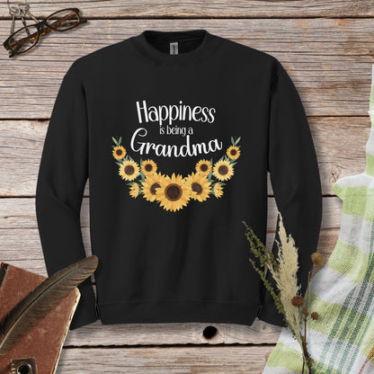 a black sweatshirt with sunflowers that says happiness is being a grandma