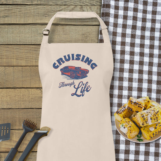 a white apron sitting on top of a table next to a plate of food