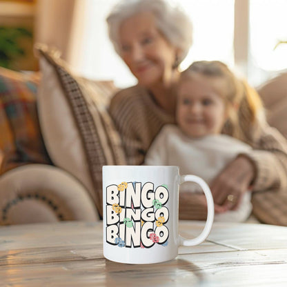 a woman and a child sitting on a couch with a coffee mug