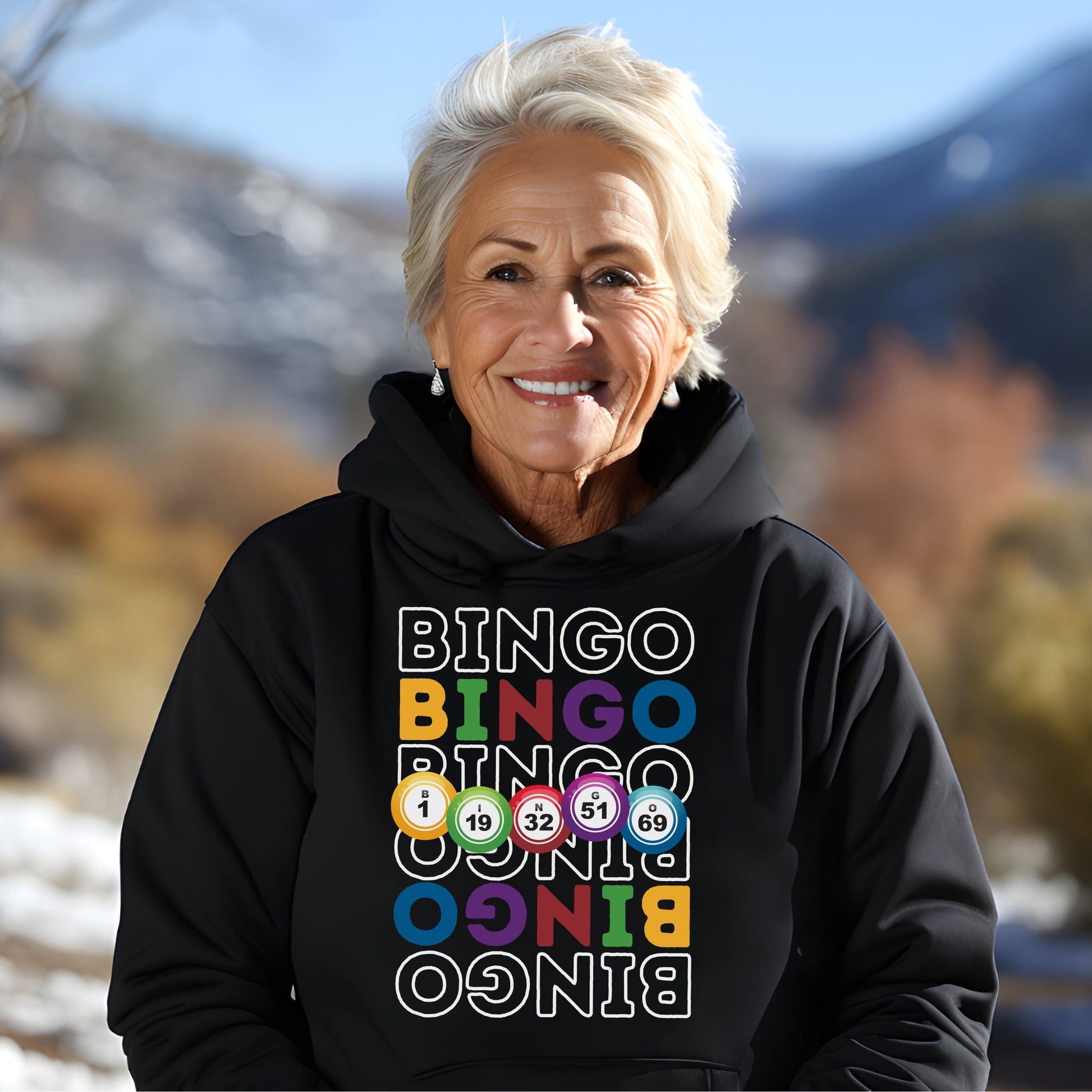 an older woman wearing a black hoodie with the word bingo on it