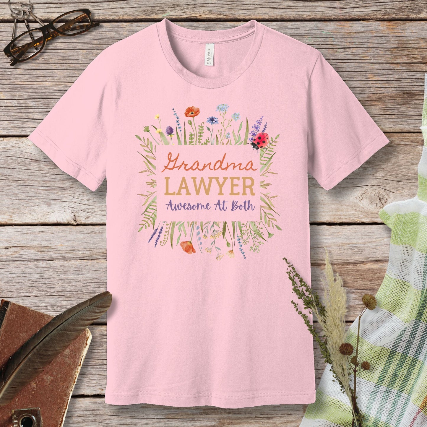 a pink t - shirt that says grandma's lawyer awesome at birth