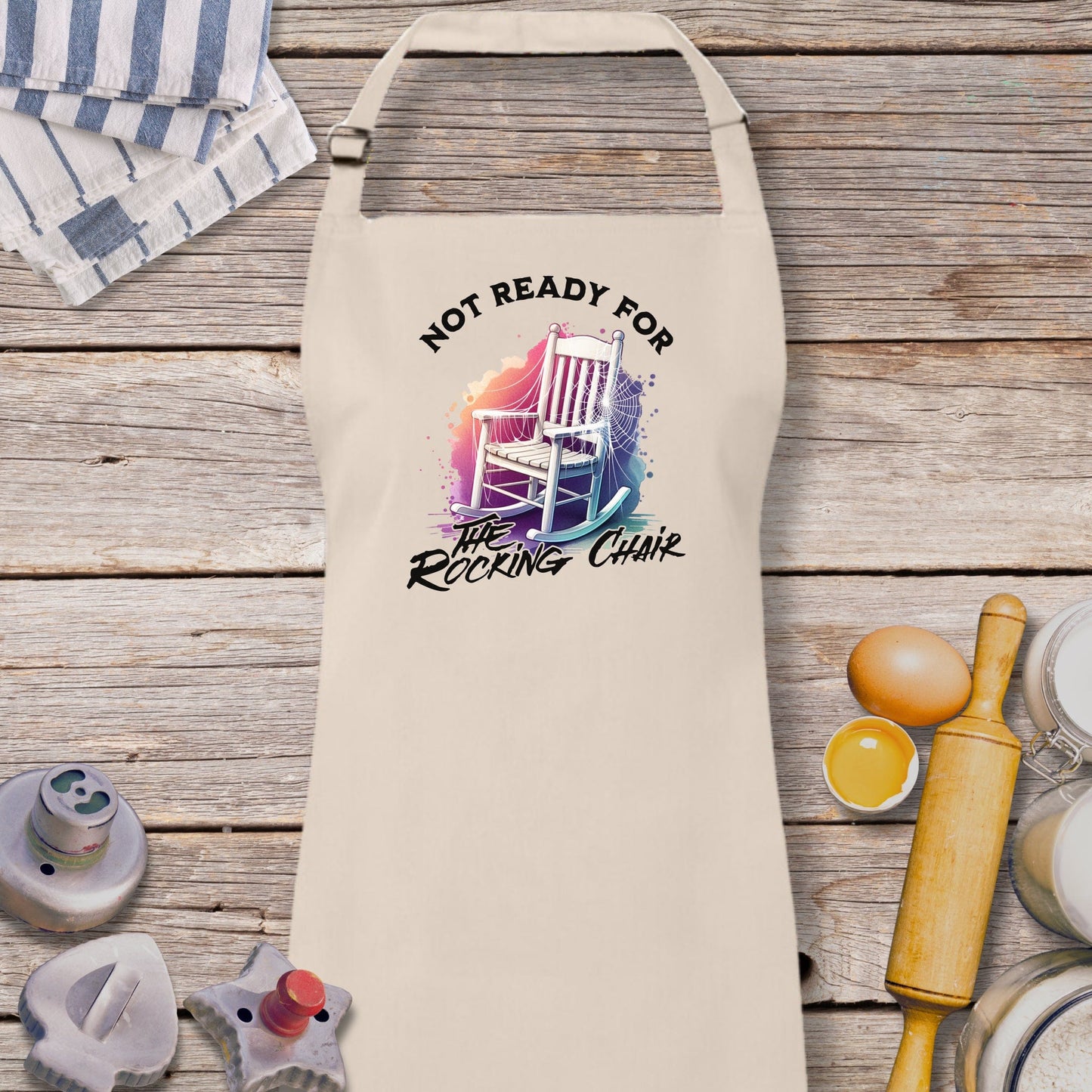 a white apron that says not ready for the rocking chair