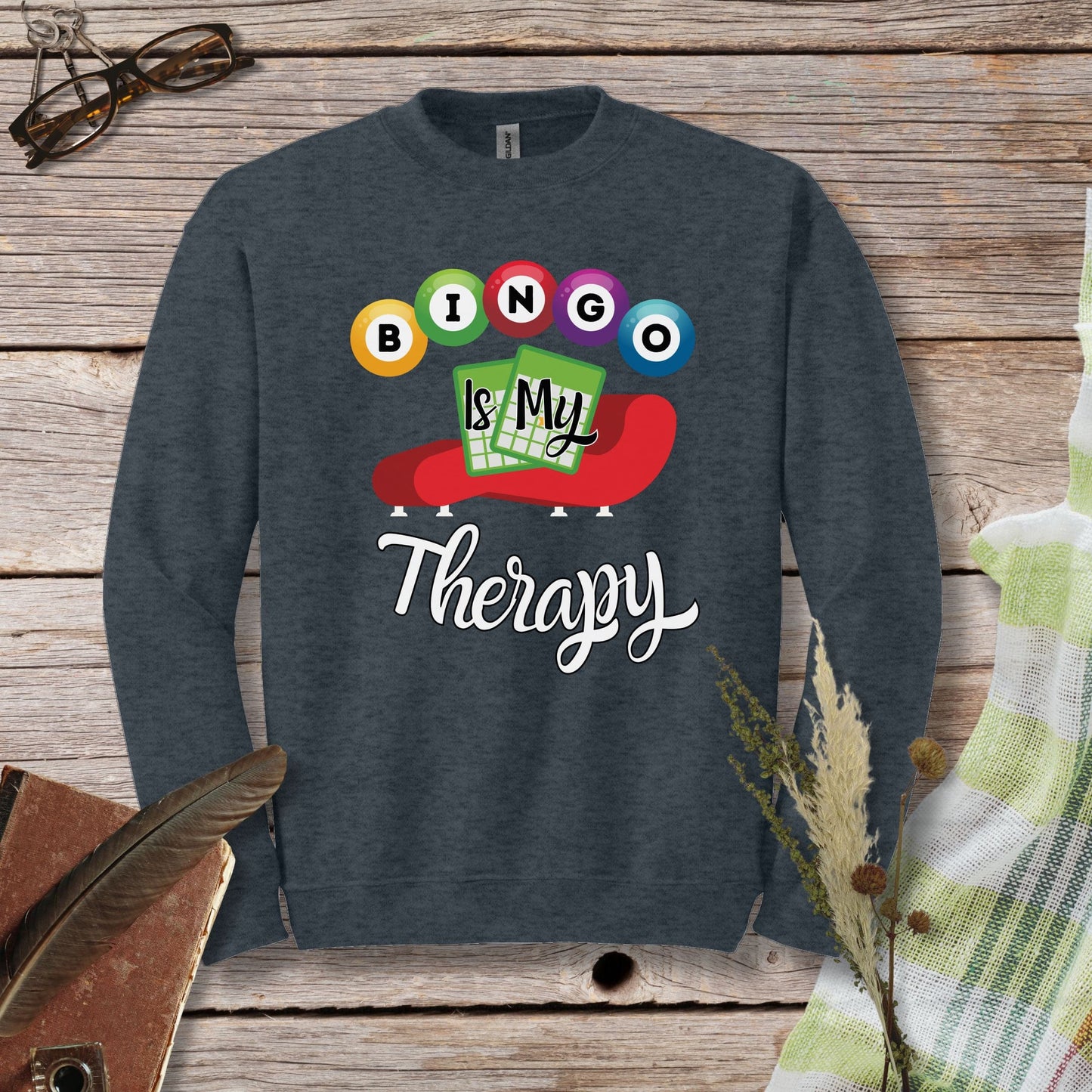 a sweatshirt that says bingo is my therapy