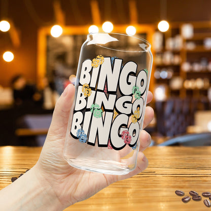 a person holding up a glass with the word ringo ringo on it