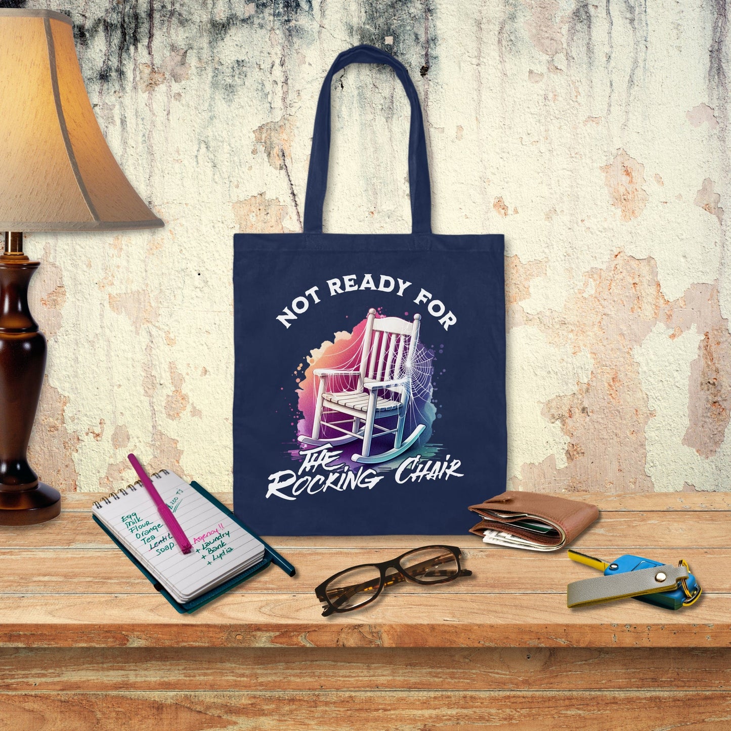 a blue tote bag sitting on top of a wooden table