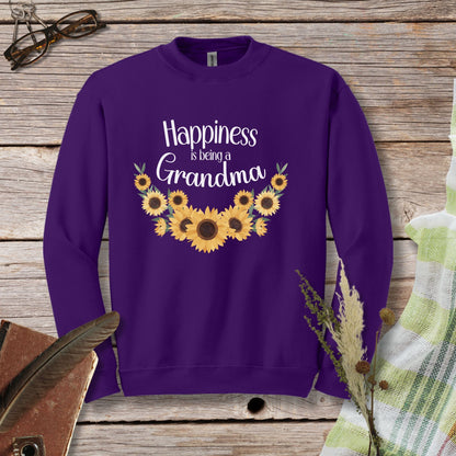 a purple sweatshirt with sunflowers and the words happiness is being a grandma