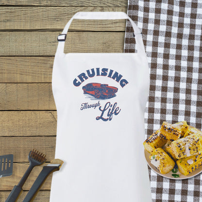 a white apron sitting on top of a table next to a plate of food