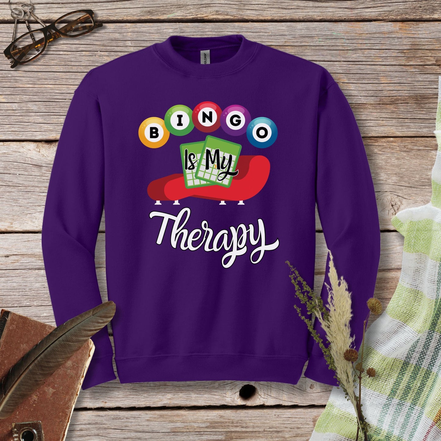 a purple sweatshirt with the words bingo is my therapy on it