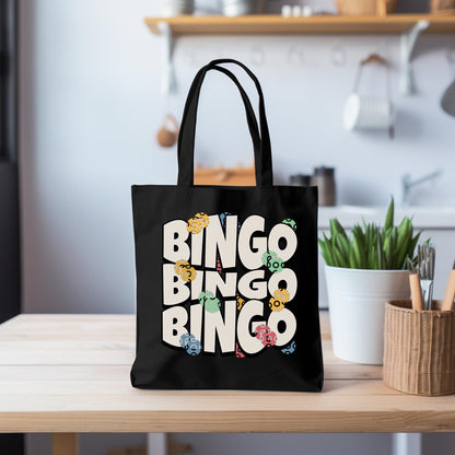 a black bag sitting on top of a wooden table