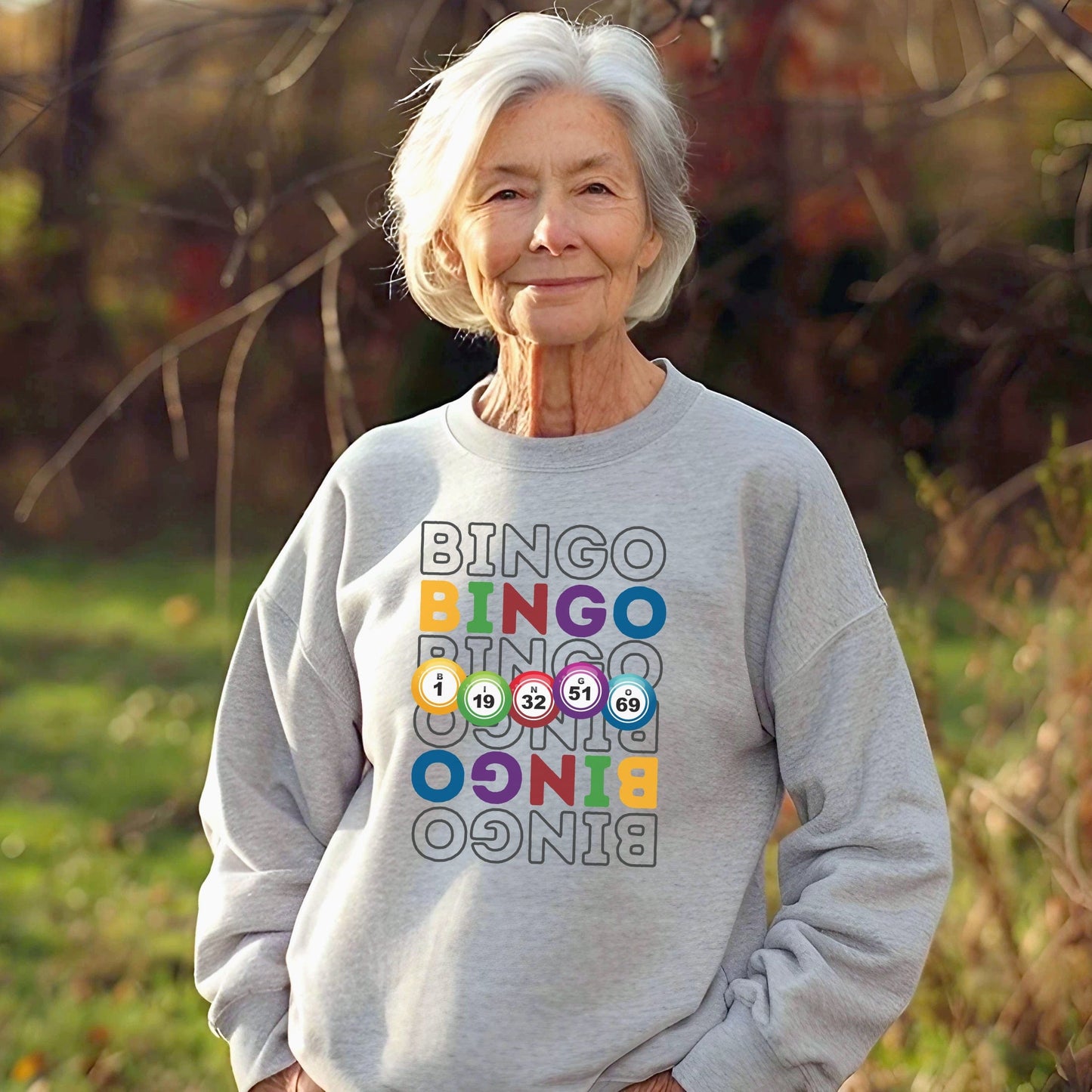 an older woman standing in a field with her hands in her pockets