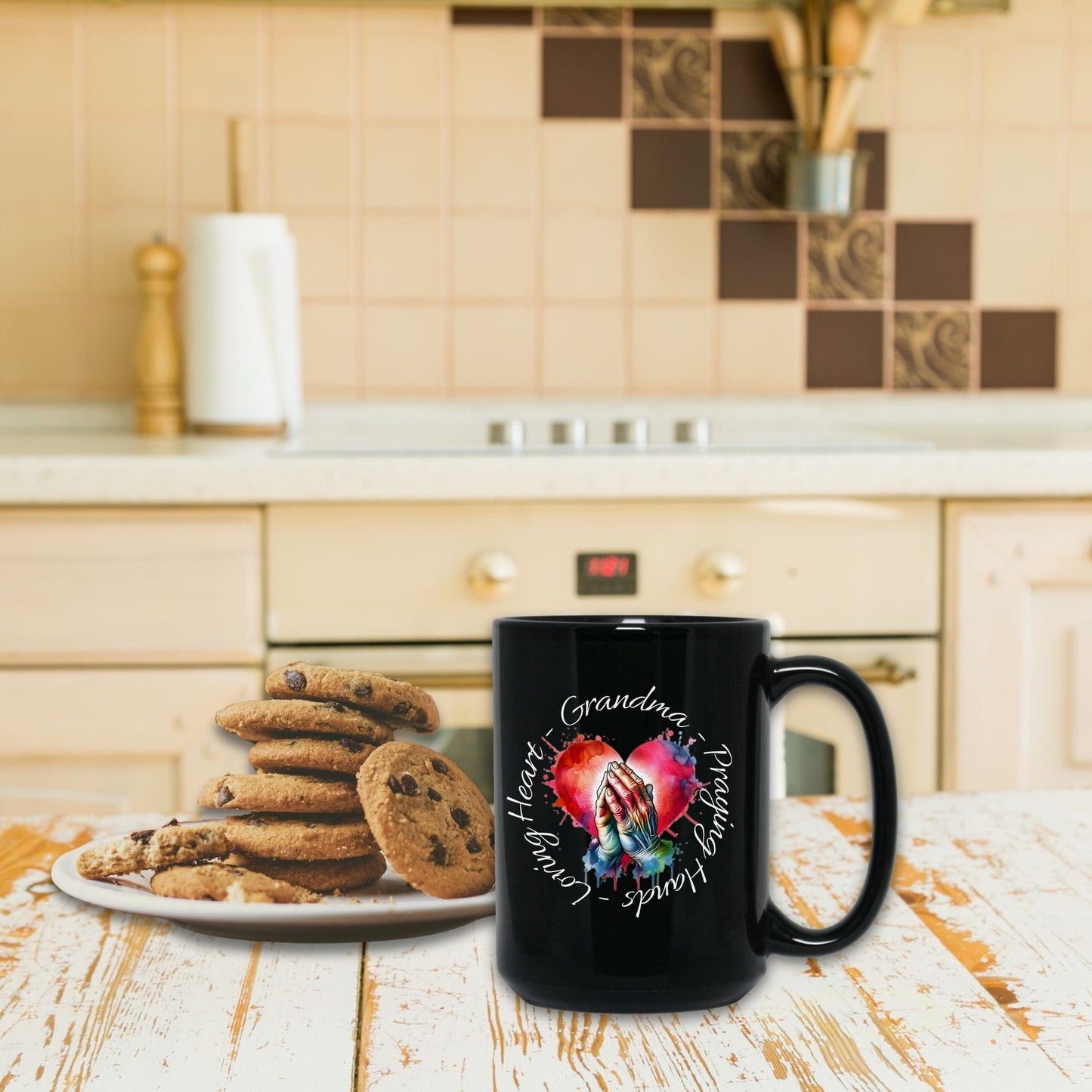 a plate of cookies and a black coffee mug