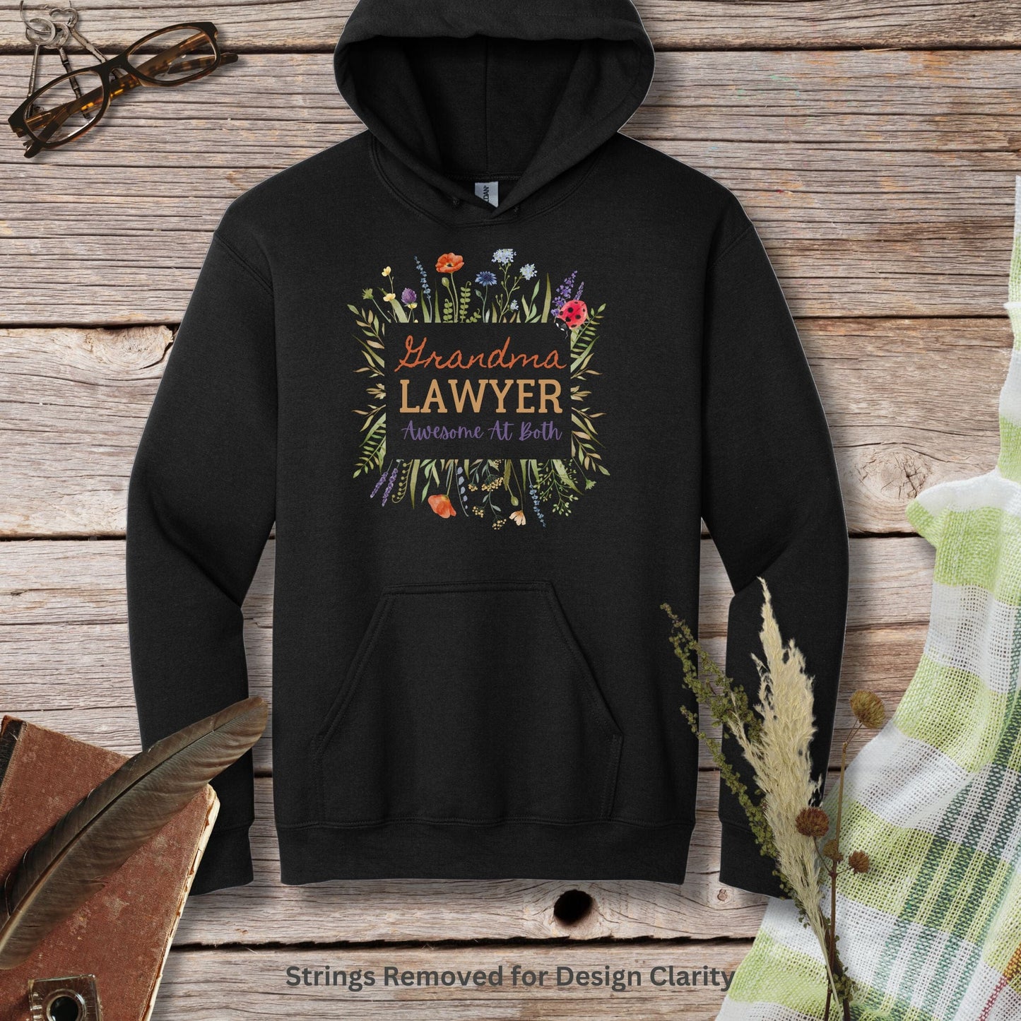 a black hoodie with the words grandma's lawyer on it