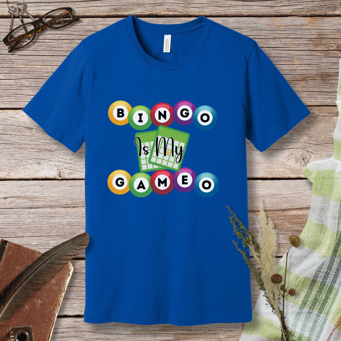 a blue t - shirt with a game design on it