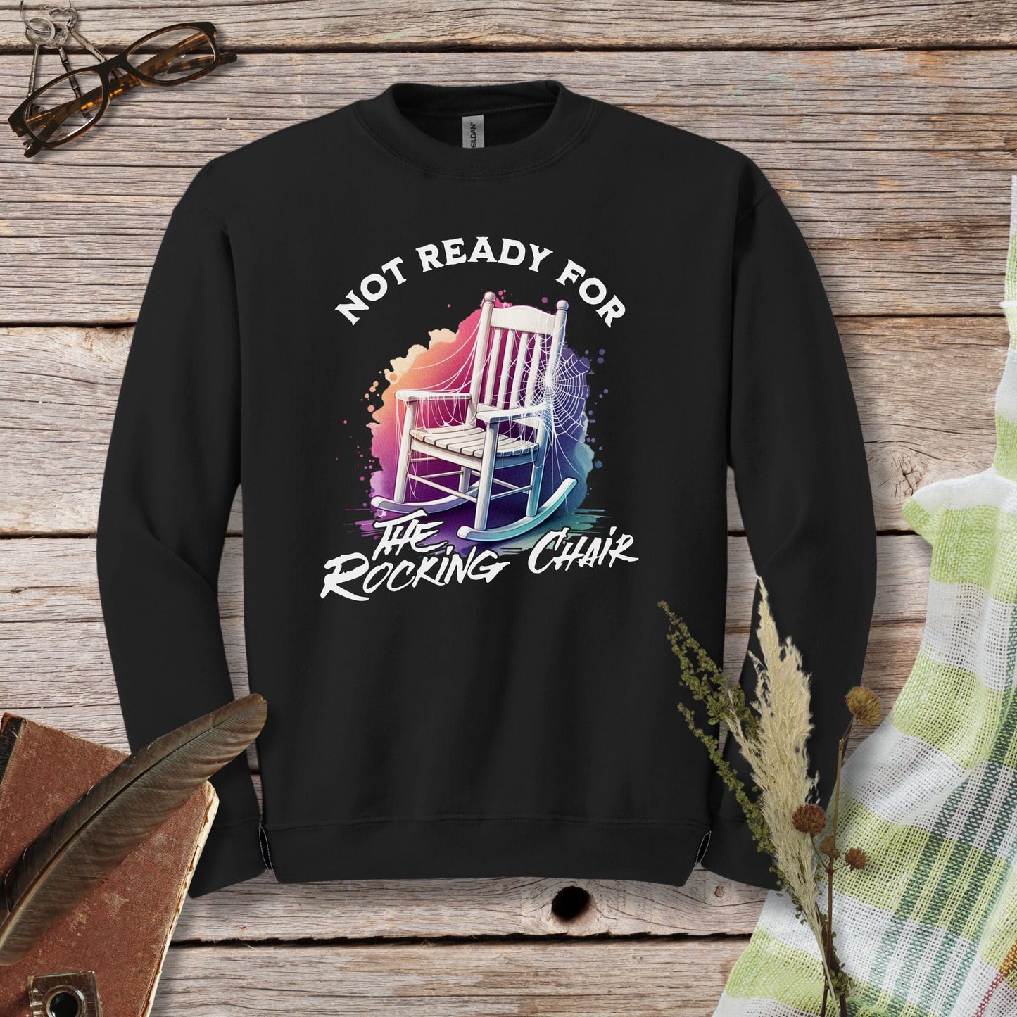 a black sweatshirt with a picture of a rocking chair on it