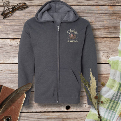 a gray hoodie with a picture of a bird on it