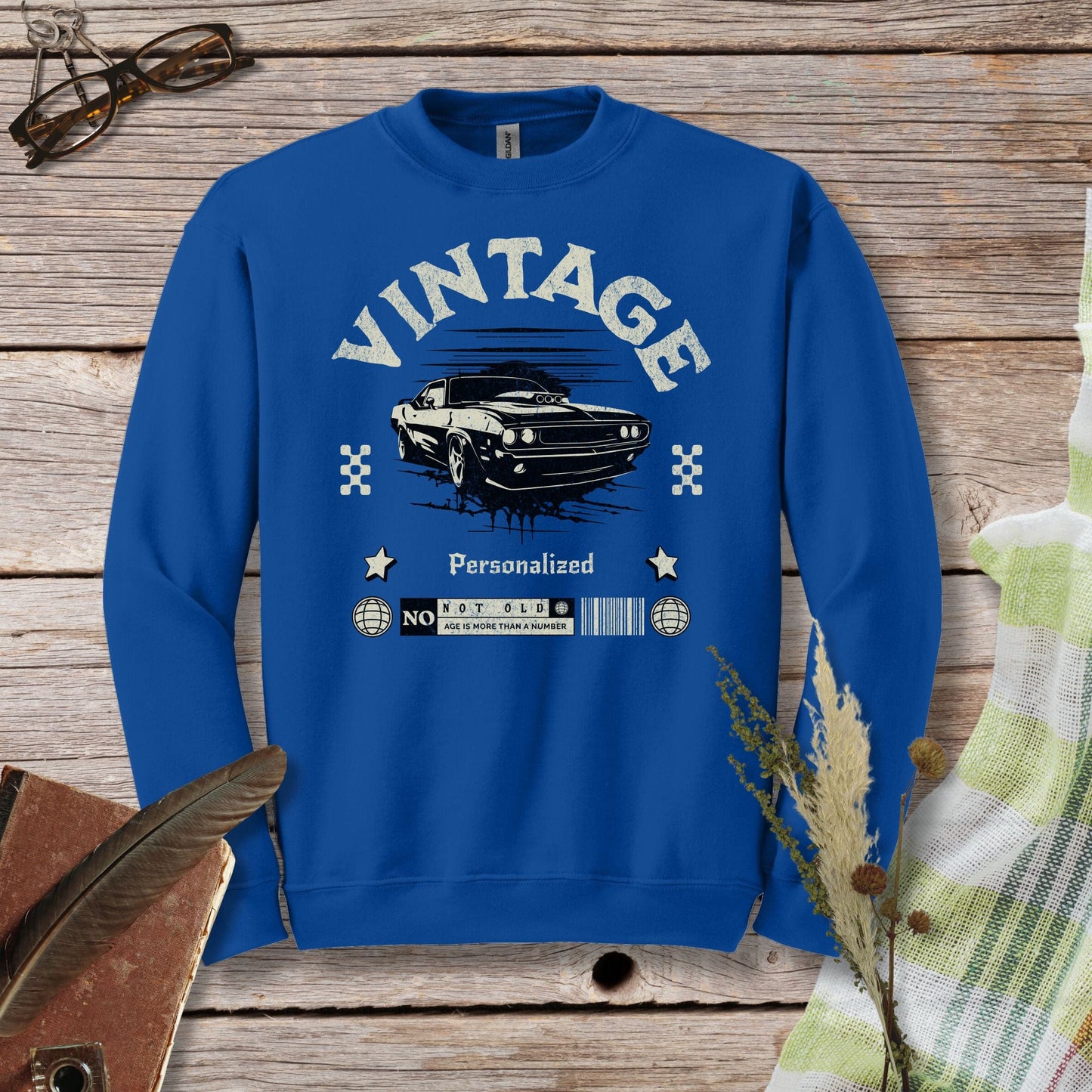 a blue sweatshirt with a picture of a car on it