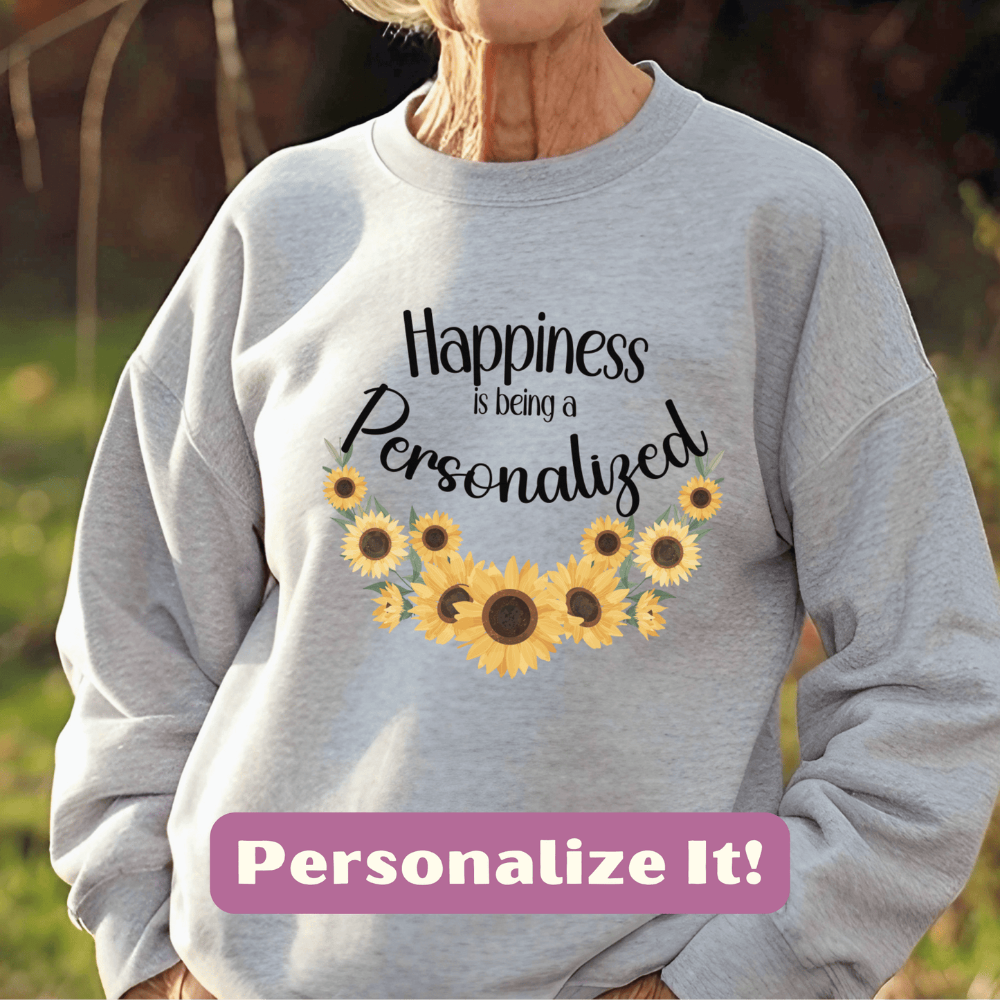 a woman wearing a sweatshirt that says happiness is being a personalized