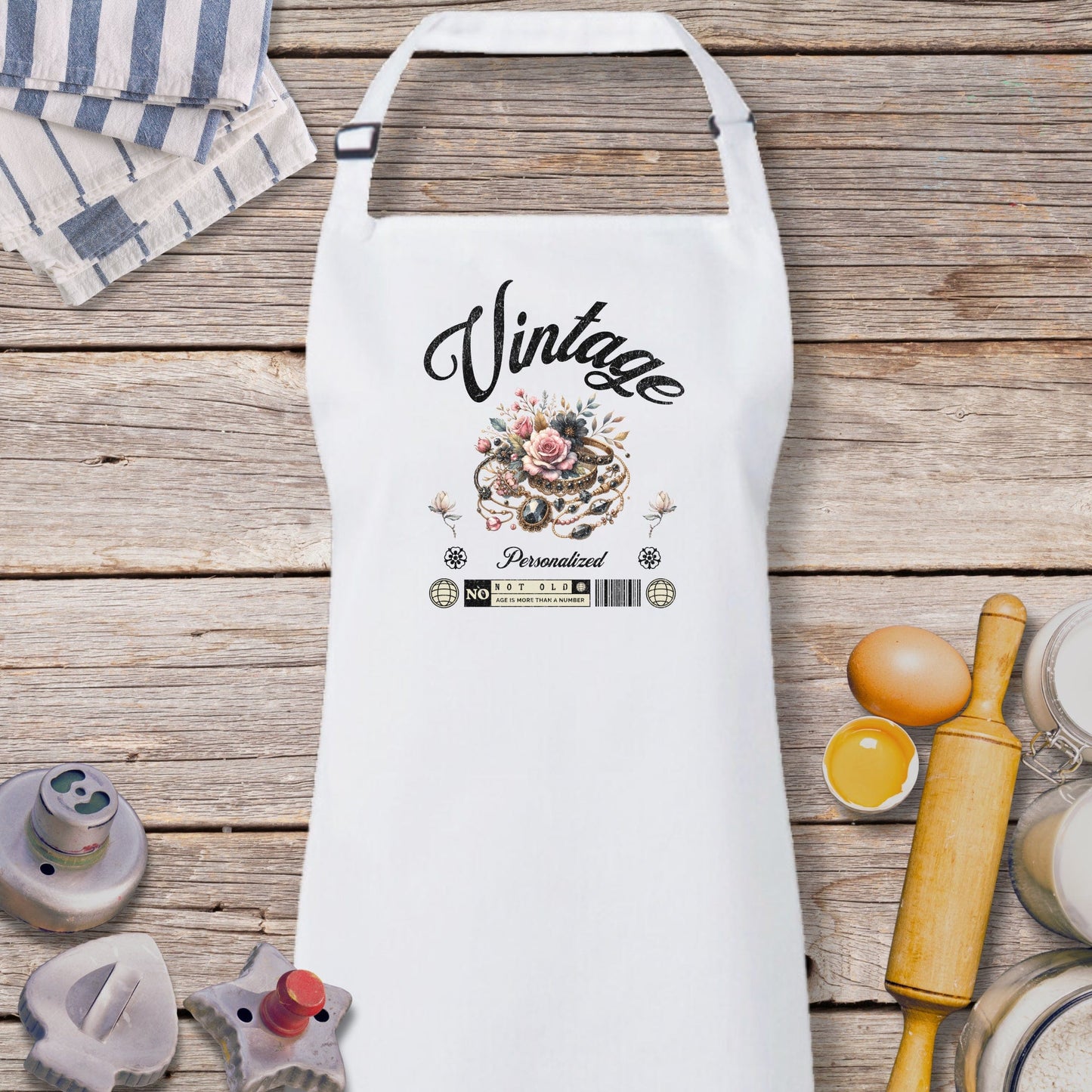 a white apron sitting on top of a wooden table