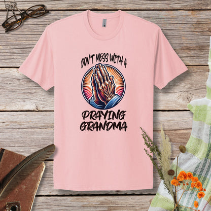 a pink t - shirt with the words don't mess with a praying grandma