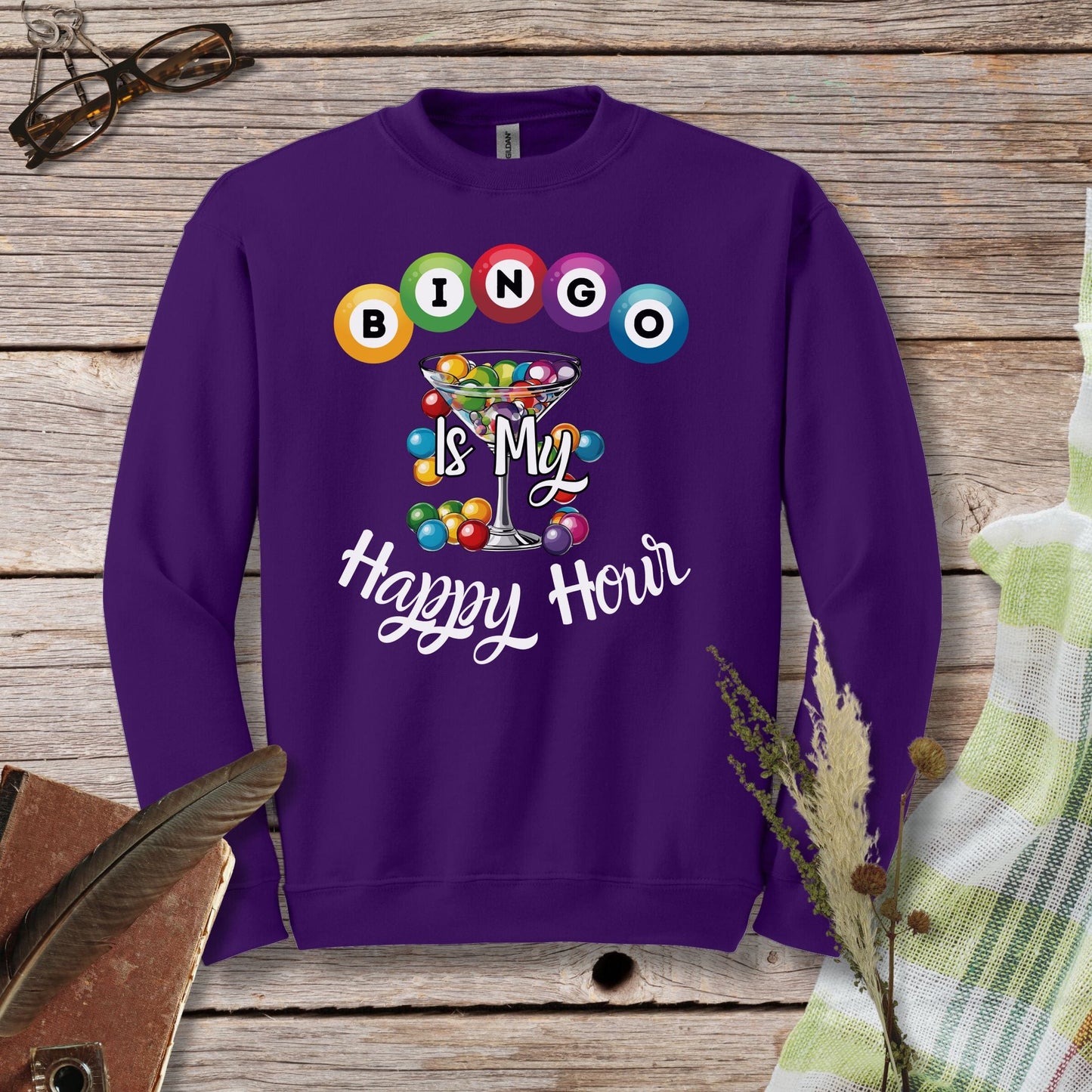 a purple sweatshirt with a happy hour design on it