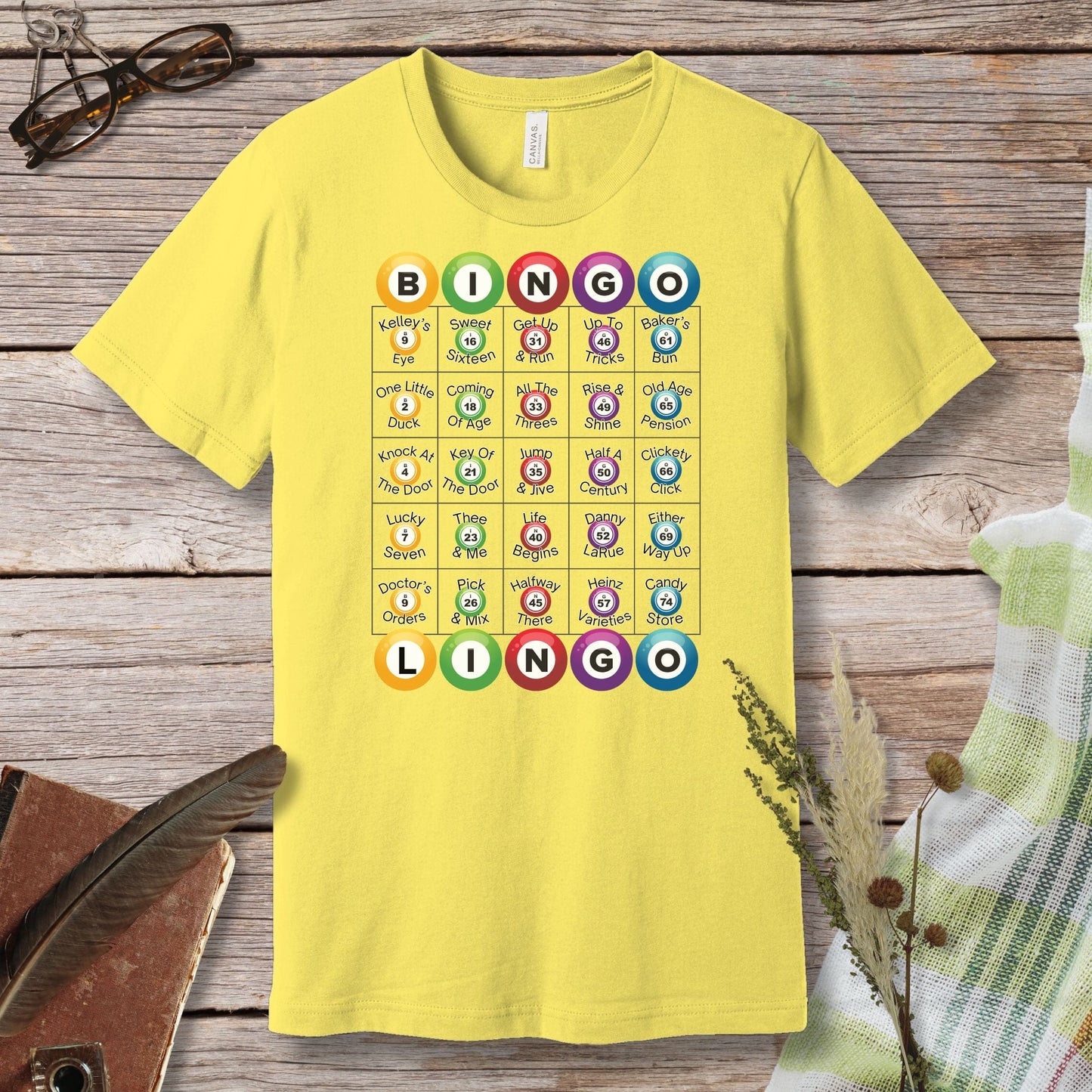 a yellow t - shirt with a picture of animals on it