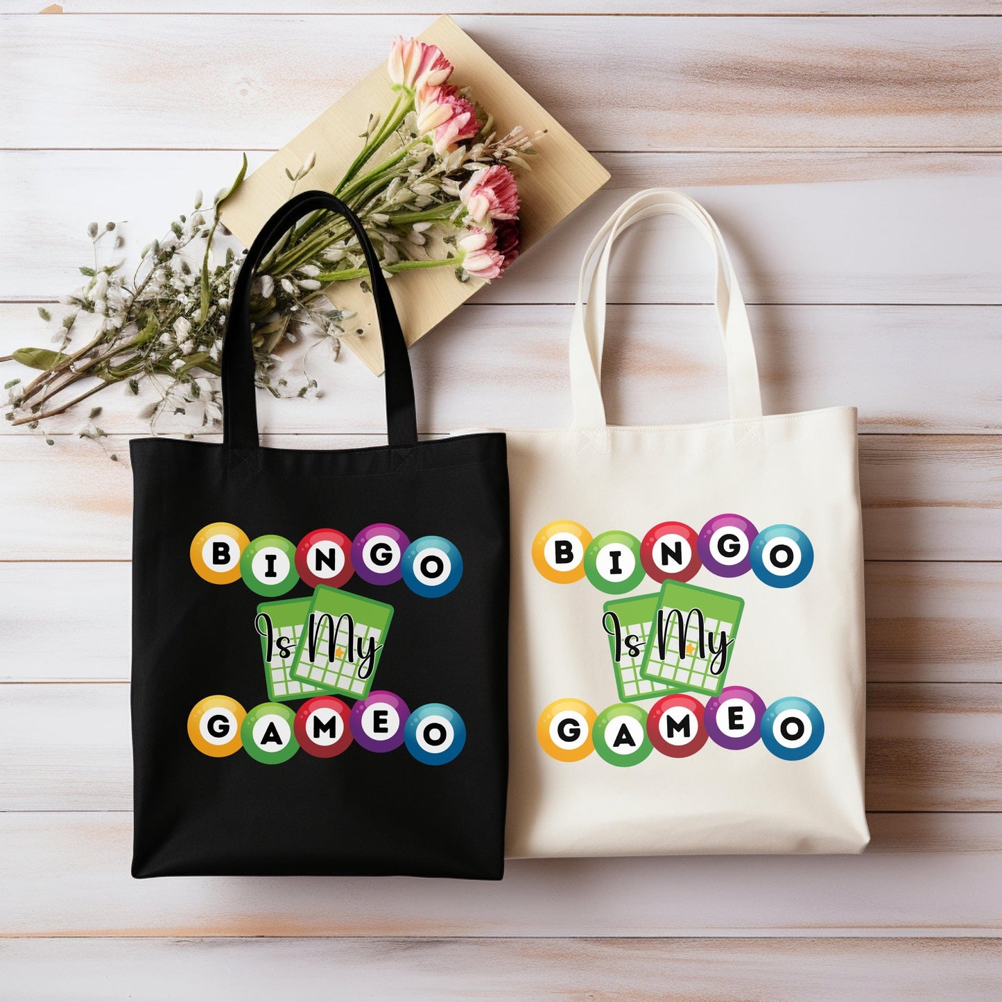 two shopping bags sitting next to each other on a table