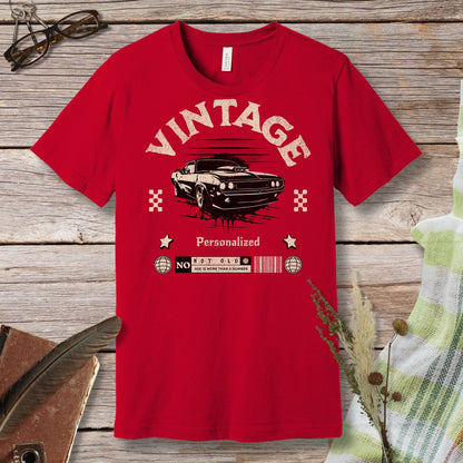 a red t - shirt with a vintage car on it