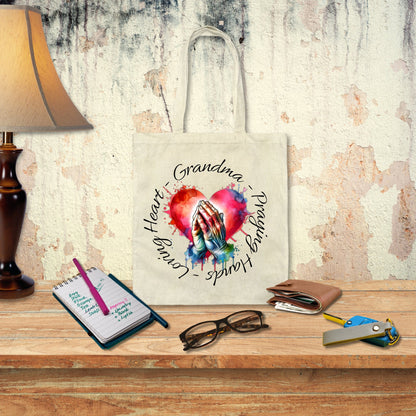 a canvas bag with a picture of two hands holding each other