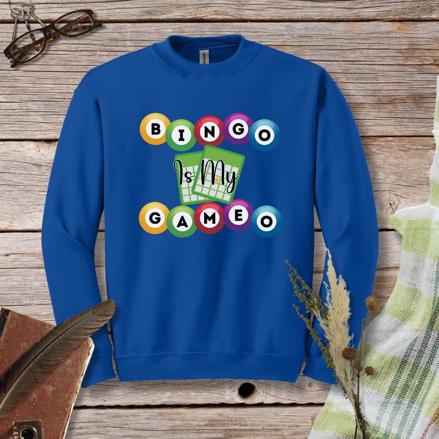 a blue sweatshirt with a game design on it