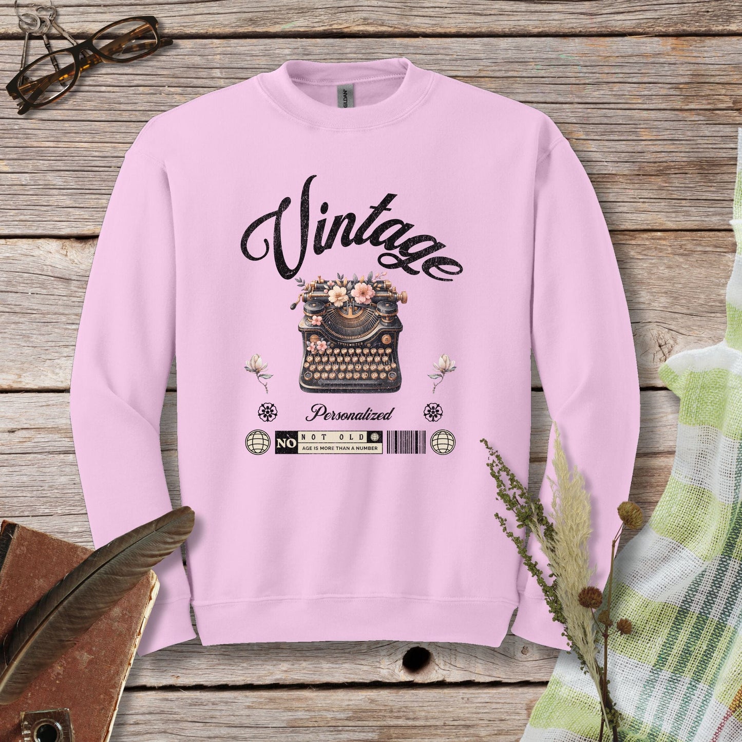 a pink sweatshirt with the words vintage printed on it