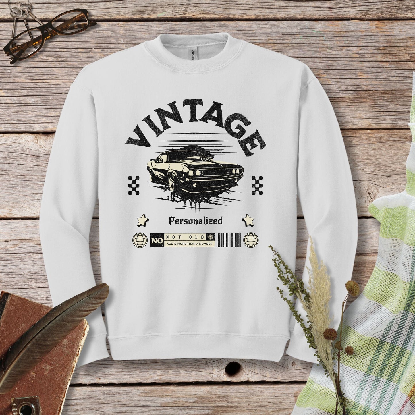 a white sweatshirt with a vintage car on it