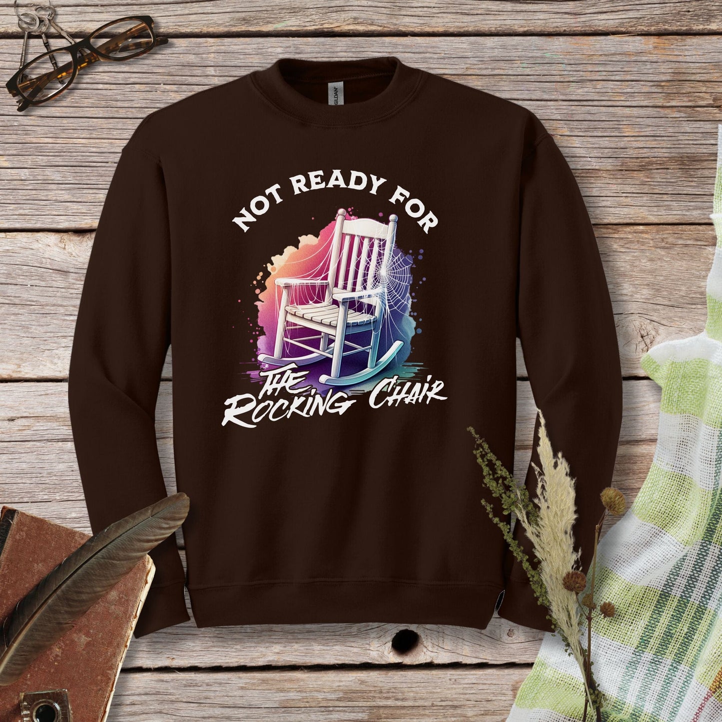 a brown sweatshirt with a picture of a rocking chair on it