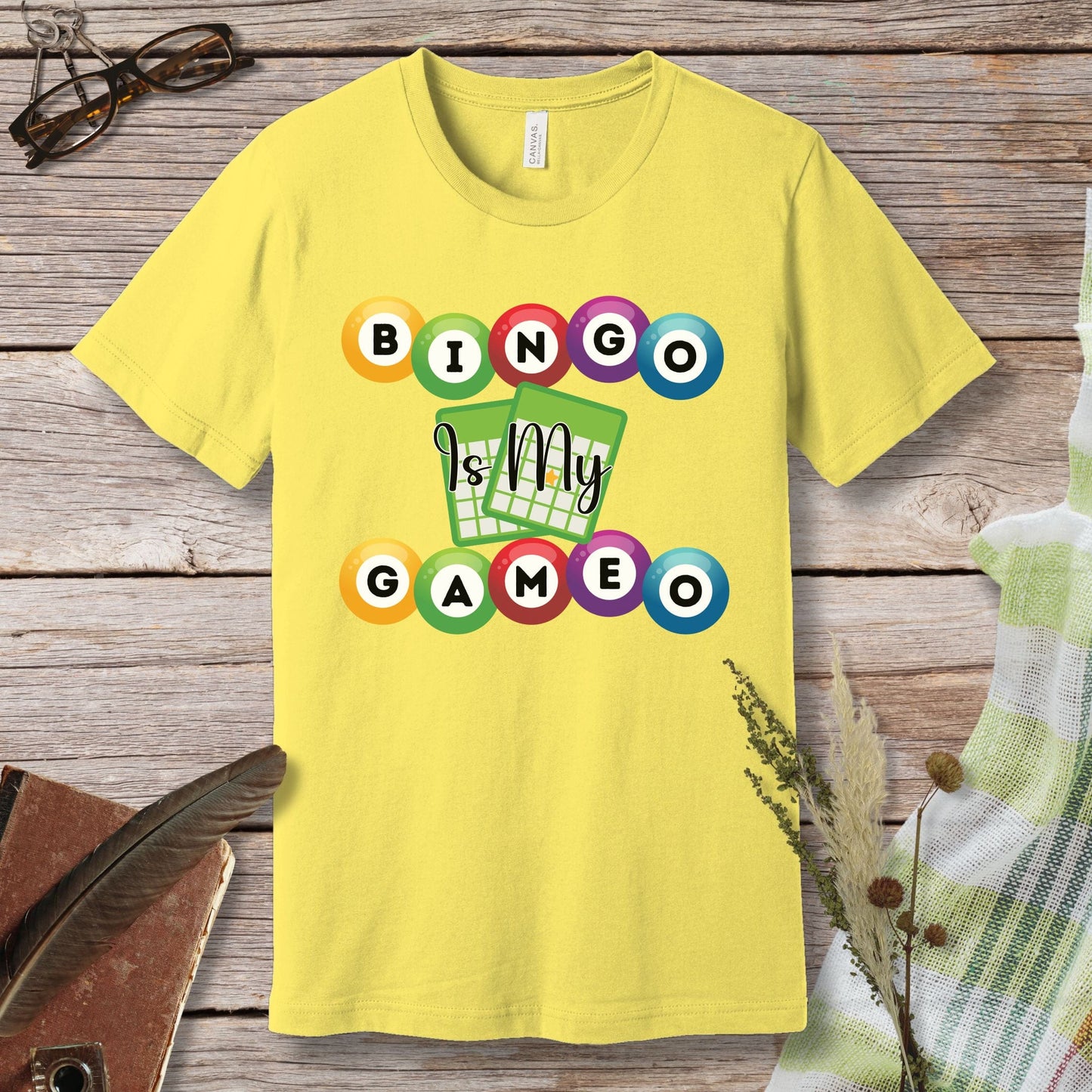 a yellow t - shirt with a game design on it