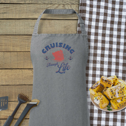 a plate of food sitting next to a gray apron