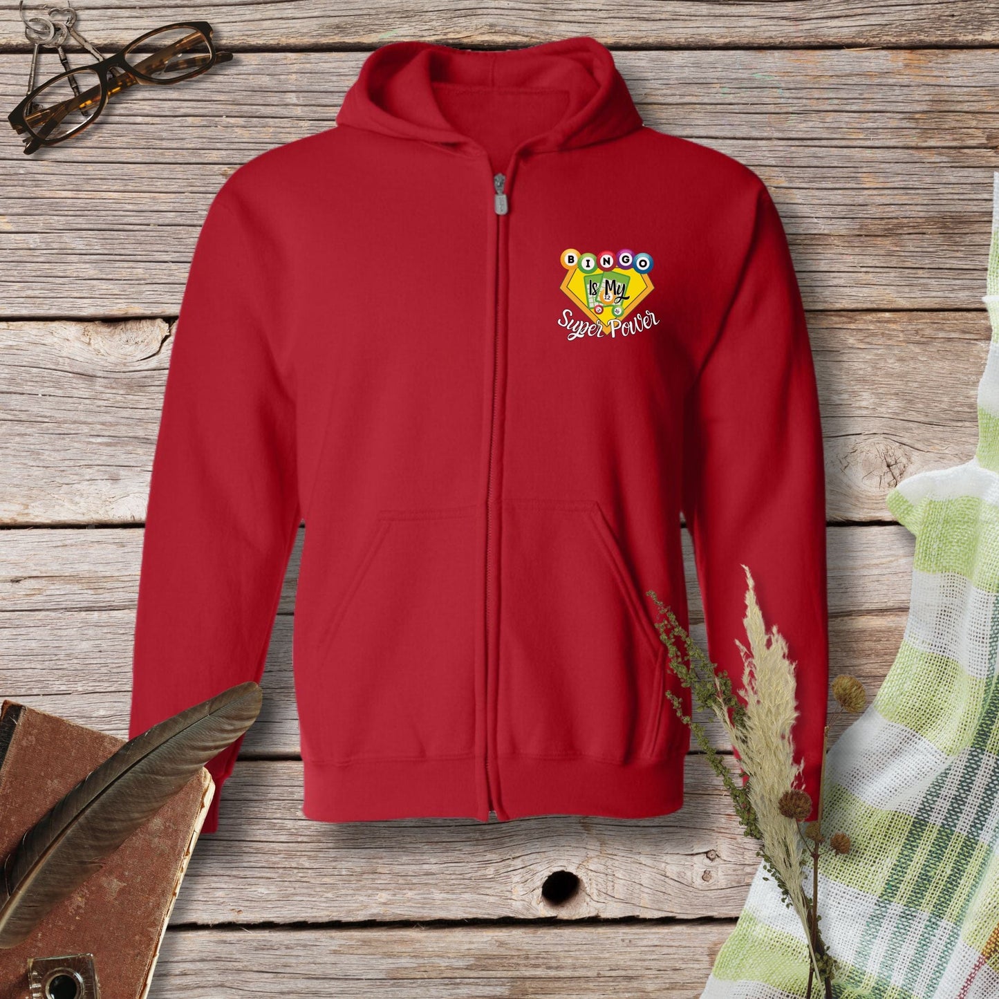 a red hoodie with a picture of a bird on it