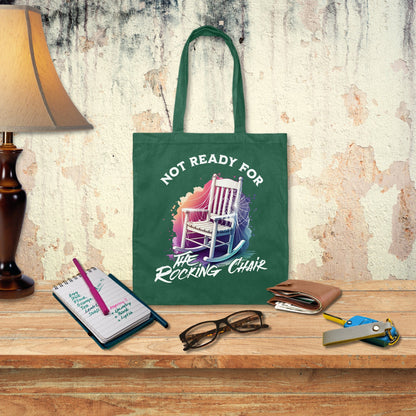 a green tote bag sitting on top of a wooden table