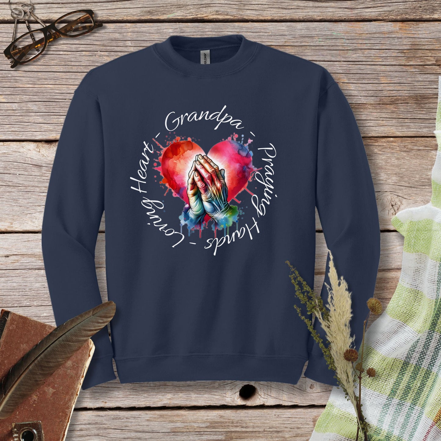 a sweatshirt with a picture of a woman's hands holding a heart