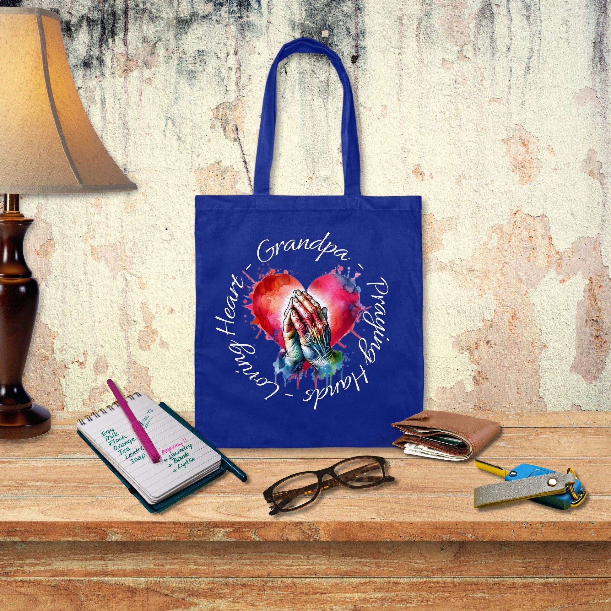 a blue tote bag sitting on top of a wooden table