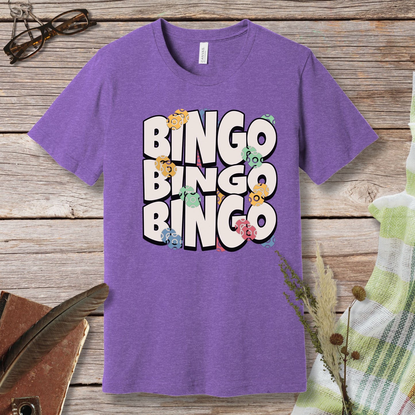 a purple t - shirt with the words bingo bingo on it