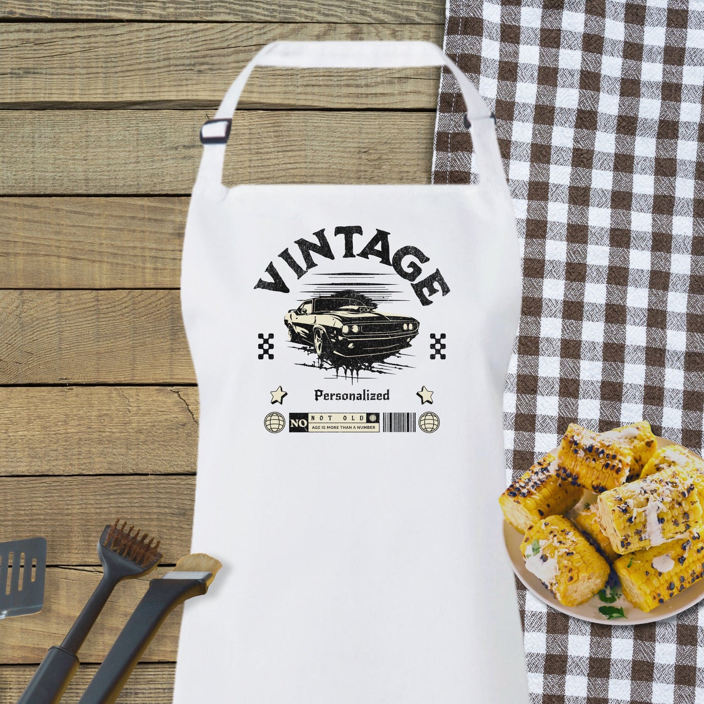 a white apron sitting on top of a table next to a plate of food