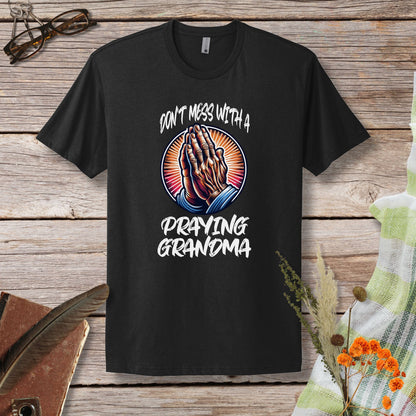 a black t - shirt with the words don't mess with a praying grandma