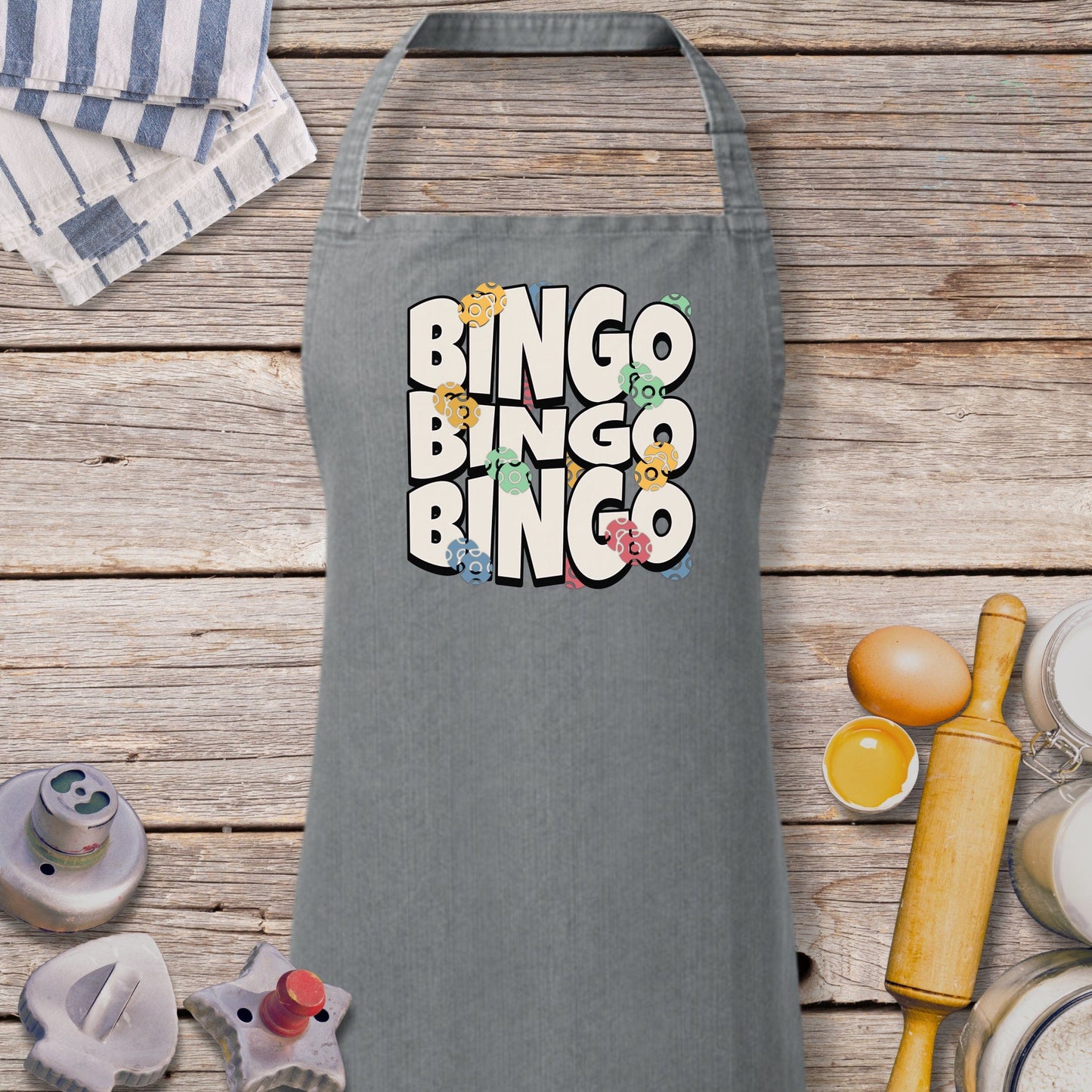 a grey apron with the words ringo bingo on it